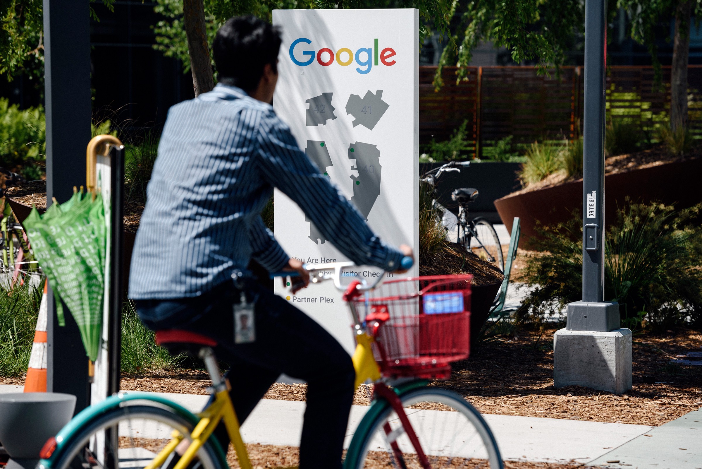 A cyclist is using a Google Assistant controlled electric bike