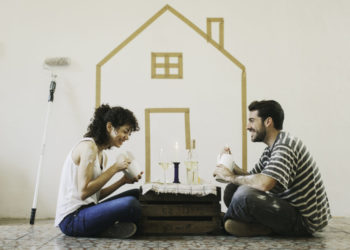 More files of this series and models on port. Young couple painting their apartment. They are sharing some fast food and celebrating, Lifestyle and interior decoration concepts. Made in Barcelona, Spain.