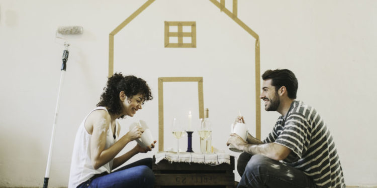 More files of this series and models on port. Young couple painting their apartment. They are sharing some fast food and celebrating, Lifestyle and interior decoration concepts. Made in Barcelona, Spain.