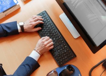 Person Typing on Computer Keyboard