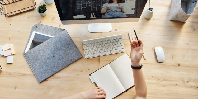 Top View Photo of Girl Watching Through Imac